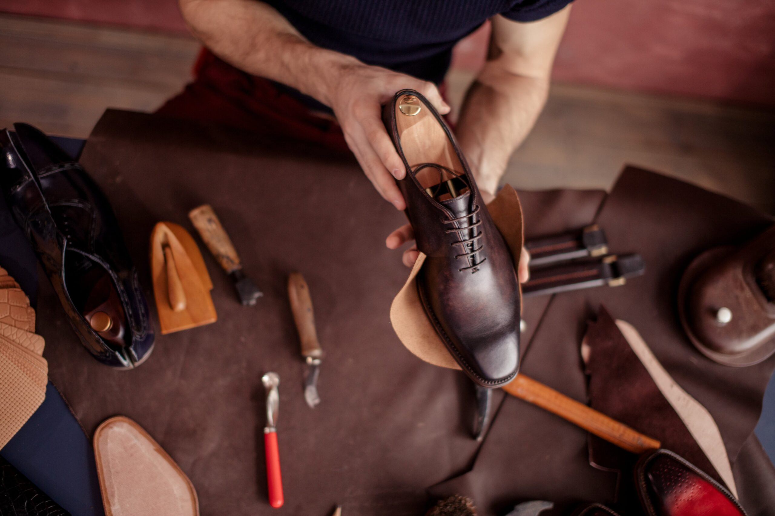 beautiful repaired shoes in man’s hands